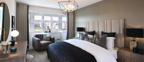 Redrow modern designed master bedroom with large bay window and stylish furniture at Oakleigh Fields