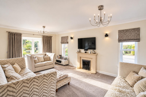 Elegant Sunlit Neutral Living Room.png