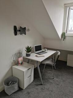 Bright, neatly-styled study corner with a white...
