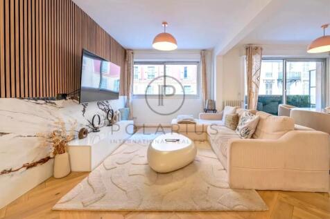 A modern living room with a neutral color scheme f