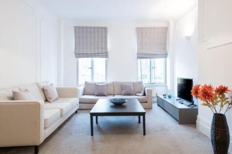 A beautifully refurbished five-bedroom apartment set on the first floor of a prestigious mansion building, boasting stunning views across Regent's Park. Offering approximately 2,362 sq ft of elegant l