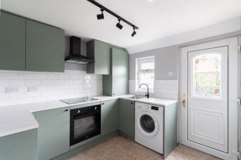 Sage Green Kitchen with Washing Machine.png