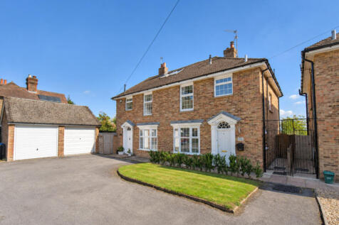 Front elevation, garden, garage and parking