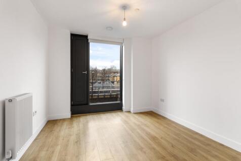 Experience the elegance of minimalist design in this brightly lit space.