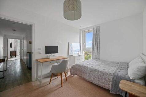 Modern two-bedroom, two-bathroom apartment on the 10th floor with stunning London views. Ideally located in Surrey Quays, moments from excellent transport links, shopping, and Canada Water station.