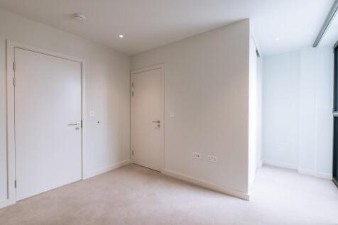 Embrace simplicity and elegance in this spacious modern room.