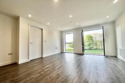 Apartment: Spacious 2-bedroom unfurnished flat in a prime location. Modern kitchen with integrated appliances, sleek bathroom, and ample storage. Close to local amenities and excellent transport links