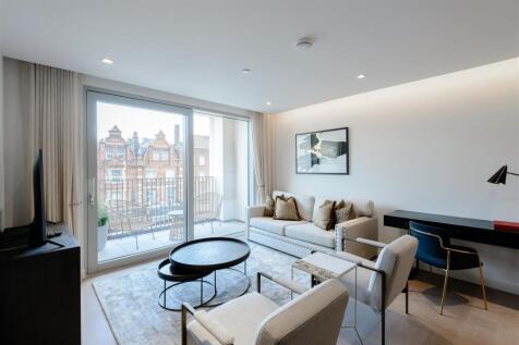 A luxurious interior designed one-bedroom 2nd floor apartment set over 559 SqFt comprising a large open-plan reception room leading onto a private balcony. The fully integrated kitchen with appliances