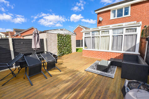 Sunny Suburban Patio with Garden Furniture