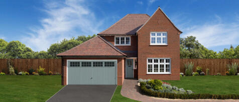 Modern two-storey red brick house with a grey garage door, front garden, and clear blue sky in a sub