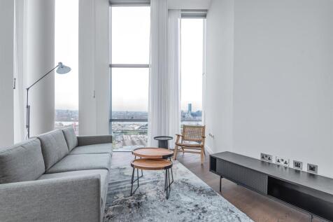 A luxury and ultra-high-spec, two-bedroom, two-bathroom, double height 'loft' apartment, located at No.5, Upper Riverside, Greenwich Peninsula. The apartment has been exquisitely interior designed and