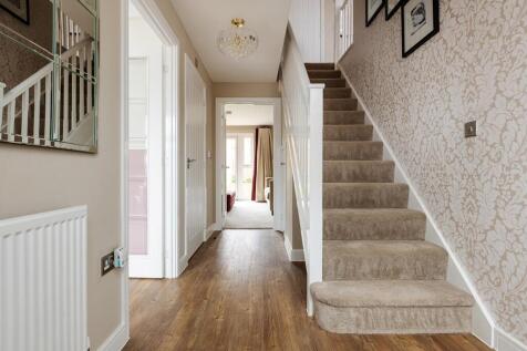 The central hallway with under stairs storage