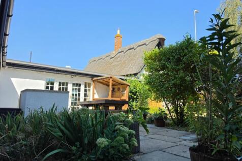Thatch Cottage Summer Patio.jpg