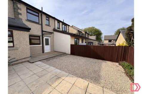 REAR OF HOUSE WITH RE-PLANNED OUTDOOR SPACE