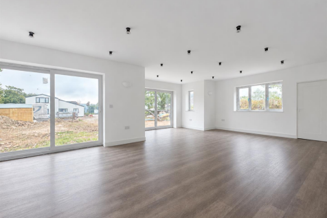 Freshly Painted White Open-Plan Room.png