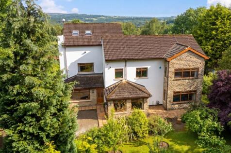 An exceptional detached family residence set within approximately 0.65 acres of beautifully landscaped private grounds on the prestigious tree-lined Clara Drive. Approached via a long gated driveway,