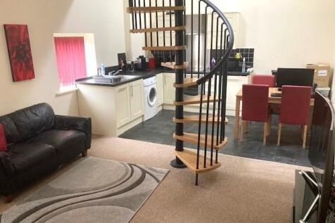 Open plan lounge into kitchen.jpg