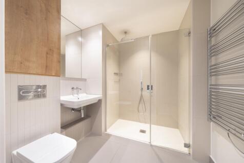 Experience luxury in this elegantly designed modern bathroom, offering a serene retreat.