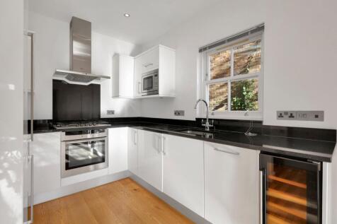 Presenting a beautifully finished 717 sq ft two-bedroom ground-floor apartment with a private garden, set on a sought-after residential street in Archway. The property offers a generous open-plan rece