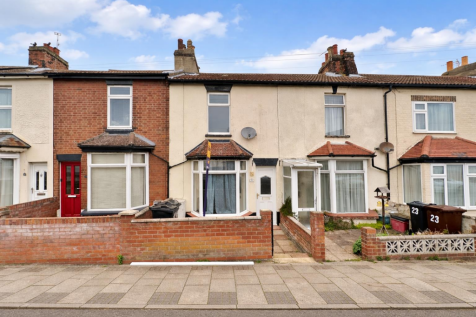 Terraced houses under a bright sky.png