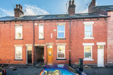 Well-maintained red-brick terraced street view ...