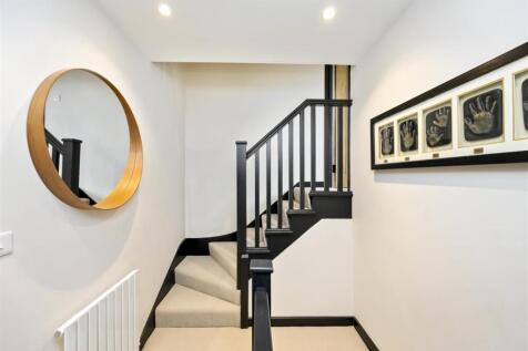 Stairs rising to First Floor