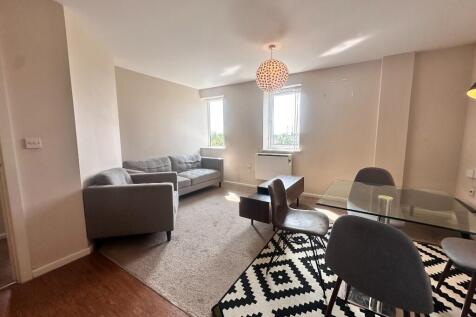 A modern and well-presented two-bedroom apartment in a convenient Stretford location, offering spacious living, parking, and excellent transport connections.