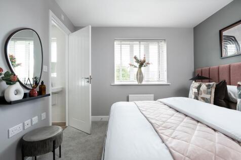 The luxurious main bedroom with en suite shower room, a private oasis to relax and unwind.