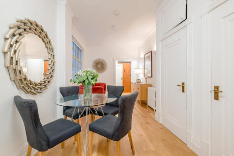 Spacious 896 sq ft two-bedroom apartment with a private patio garden opposite Regent's Park. Featuring a bespoke kitchen, separate dining room, porter, lift and CCTV. Pet friendly and close to St John