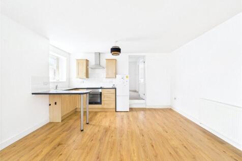 A generously sized one-bedroom ground floor flat offering comfortable, characterful living in a well-established building.