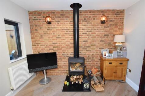 Wood burner in summer room.jpg
