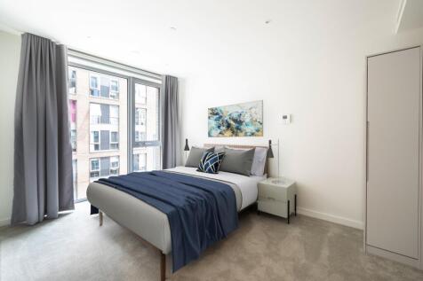 Experience luxury and comfort in this beautifully designed bedroom with expansive city views.