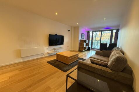Fabulous two bedroom apartment in highly desirable development close to Deansgate station. This property comprises of a spacious open plan living area complete with a fully fitted Bose surround sound