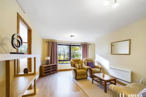 A generously proportioned two-bedroom first-floor flat set in the tranquil surroundings of Juniper Green, offering open outlooks, excellent living space, and the added advantage of a private garage. A