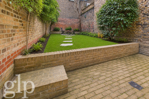 Refurbished four-bedroom townhouse with rare central London garden, dual balconies, and two reception rooms, moments from Kings Cross and Euston Stations.