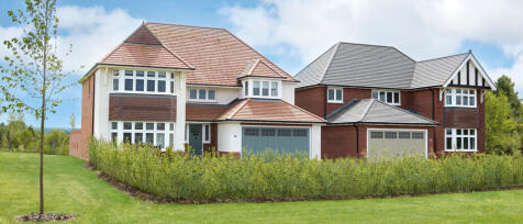 Modern detached house with a large garden, multiple bay windows, and a mix of brick and white exteri