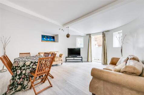 A spacious two double bedroom flat with private garden located opposite Clapham Common benefitting from off road parking, private entrance, spacious reception room, separate fully fitted kitchen, mode