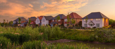 Redrow autumn street scene with heritage style houses and early evening sky