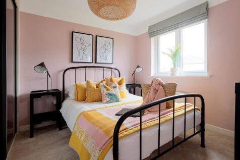Bedroom two enjoys views over the rear garden