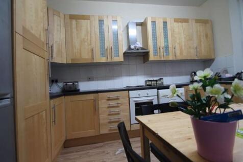 A well-maintained kitchen with ample storage ca...