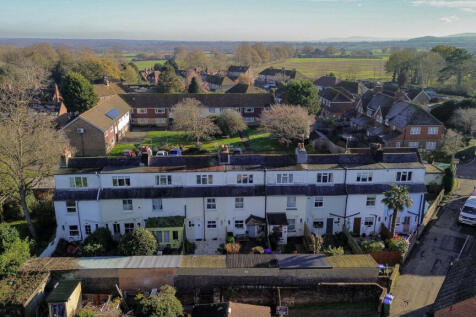 Elevated view over the house showing open countryside and walks beyond