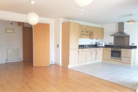 Fantastic two double bedroom apartment quietly located within an attractive development, offers stylish lateral space with a stunning south-facing reception room including a fully integrated open-plan