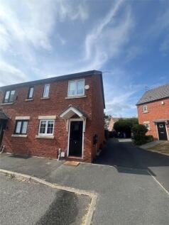 A modern two bedroom semi detached house in a cul de sac location with parking for cars.
