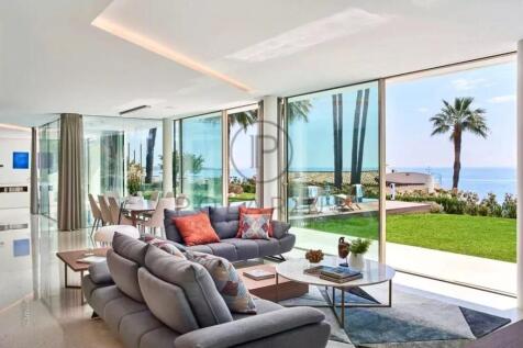 Modern living room with large glass windows, offer