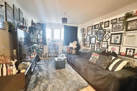 Social living area with large sofa and characte...
