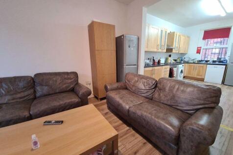 A spacious and inviting living room featuring c...