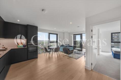 A light-filled, upper-floor two-bedroom, two-bathroom apartment with a balcony in Park & Sayer minutes from the park and Elephant and Castle’s town centre. The open-plan, modern living space has an im