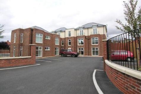 Modern ground floor apartment just moments from the beach, offering two spacious double bedrooms (master with en-suite), a bright open-plan lounge/kitchen, stylish bathroom, allocated parking and secu
