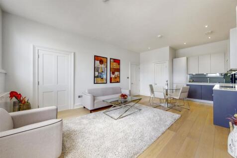 SHORT LET: ALL BILLS INCLUDED. A three-bedroom flat occupies the top two floors of an immaculate, stucco-fronted building. The interior comprises, briefly: a bright and spacious, open-plan kitchen/ re