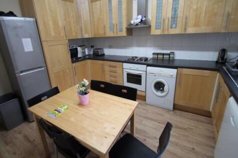A modern, well-maintained kitchen featuring woo...